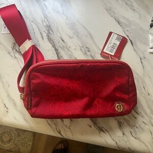 Lululemon Athletica Red Crossbody Bag with Metallic Sheen